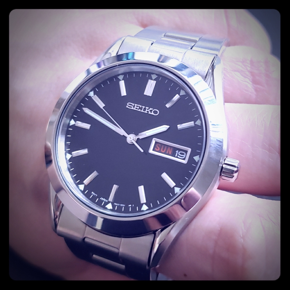 Seiko Men's stainless steel watch with day and dat